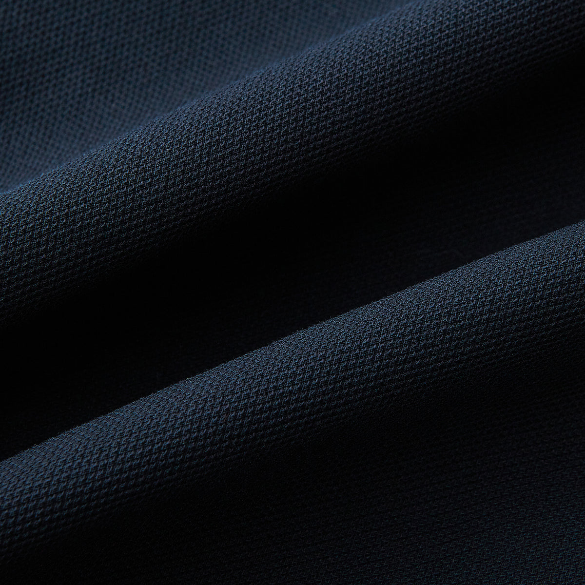 View 7 of product A pair of navy, straight-leg Amberley trousers in cotton by Turnbull & Asser UK, featuring belt loops, a button closure, and a zip fly in the classic Windsor style, displayed on a plain white background.
