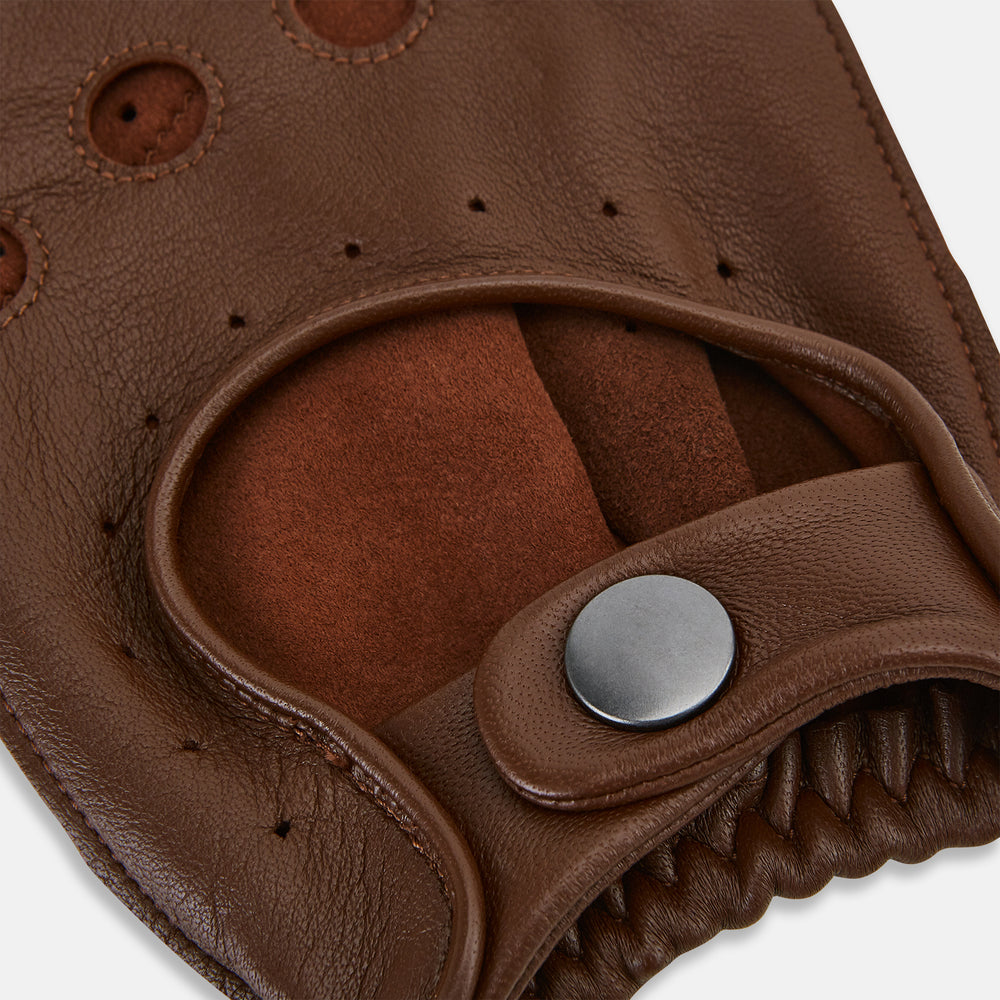 A pair of Turnbull & Asser UK Coffee Brown Fingerless Driving Gloves in leather, featuring perforated knuckles, a snap closure, and an elastic wristband, are displayed palm-up and palm-down on a white background.