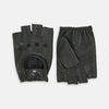 View 1 of product A pair of Forest Green Fingerless Driving Gloves in leather by Turnbull & Asser UK, one displayed palm-up to show the snap closure and the other back-up to highlight the perforated details reminiscent of classic knuckle hole gloves.