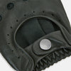 View 3 of product A pair of Forest Green Fingerless Driving Gloves in leather by Turnbull & Asser UK, one displayed palm-up to show the snap closure and the other back-up to highlight the perforated details reminiscent of classic knuckle hole gloves.