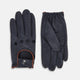 A pair of navy leather driving gloves from Turnbull & Asser UK, featuring perforations and snap closures; one glove displays the palm side while the other shows the back. These unlined Navy Driving Gloves combine style and flexibility for an optimal driving experience.