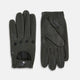 A pair of forest green leather unlined driving gloves from Turnbull & Asser UK, featuring perforated knuckles and backs, snap closures, and visible stitching, displayed flat on a white background. These gloves offer flexibility and comfort for an exceptional driving experience.