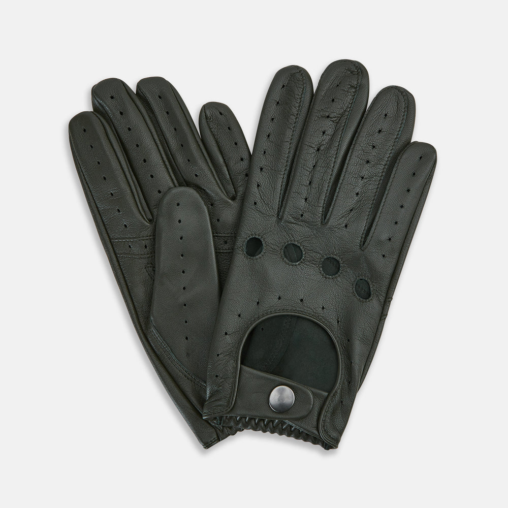 A pair of forest green leather unlined driving gloves from Turnbull & Asser UK, featuring perforated knuckles and backs, snap closures, and visible stitching, displayed flat on a white background. These gloves offer flexibility and comfort for an exceptional driving experience.