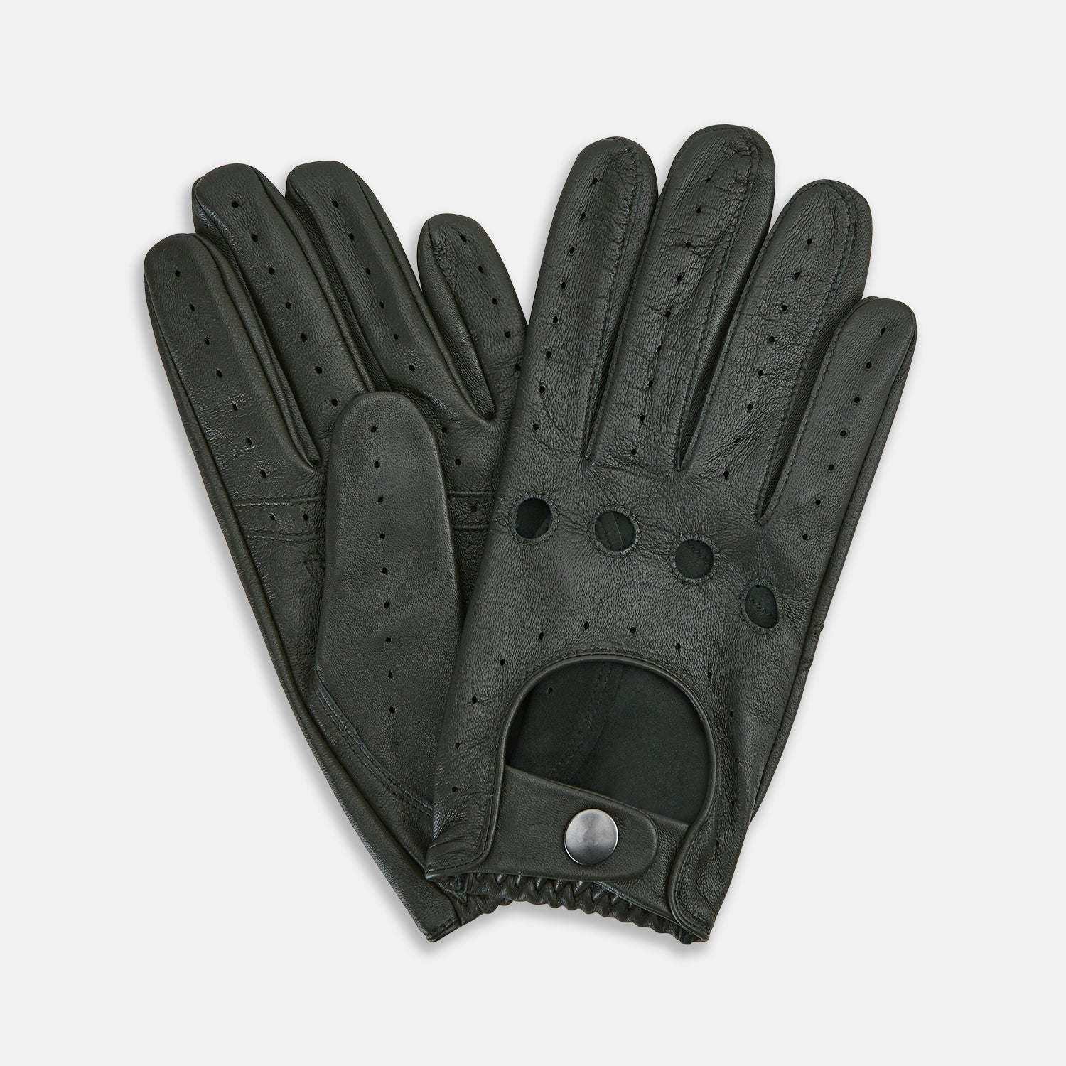 View 2 of product A pair of forest green leather unlined driving gloves from Turnbull & Asser UK, featuring perforated knuckles and backs, snap closures, and visible stitching, displayed flat on a white background. These gloves offer flexibility and comfort for an exceptional driving experience.