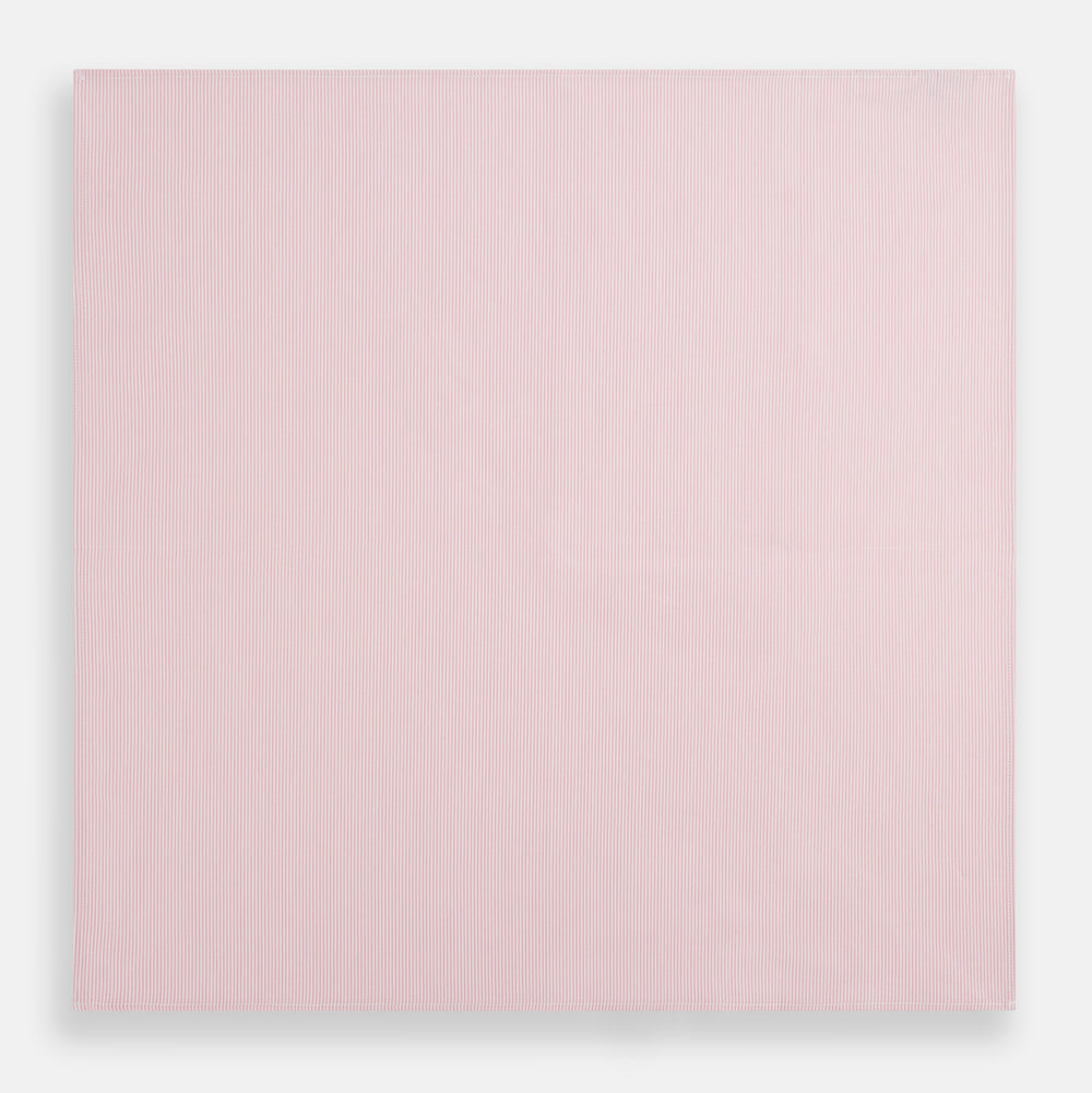 The Turnbull & Asser Pink Pencil Stripe Handkerchief, crafted from soft cotton, is neatly folded and displayed on a white background—a sophisticated formal accessory for any occasion.
