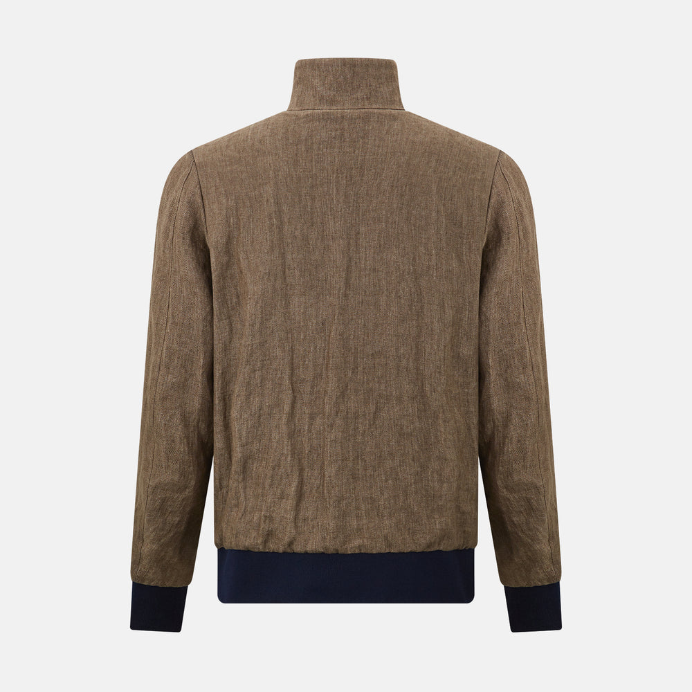 The Fairway Pinecone Golf Jacket in Linen by Turnbull & Asser UK is a brown zip-up jacket featuring a high collar, two side pockets, a zippered chest pocket, and dark cuffs and hem. Crafted from lightweight herringbone linen, it is displayed on a white background.