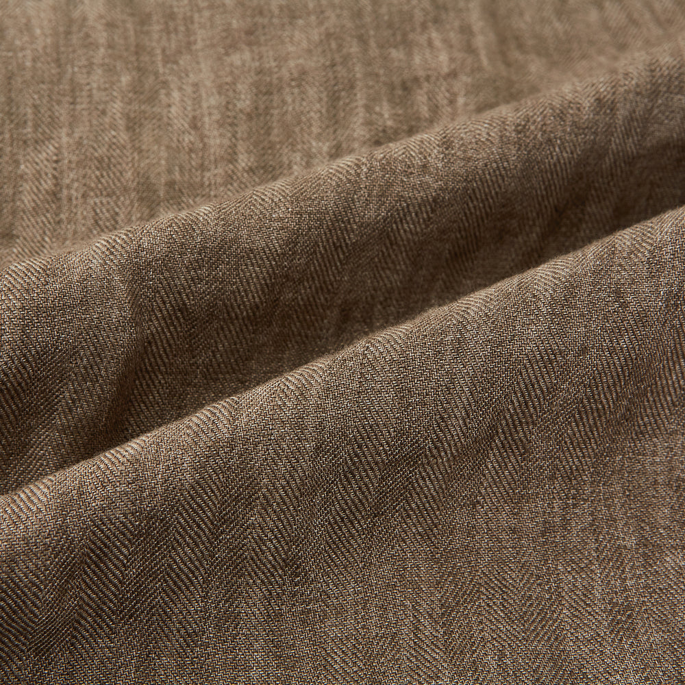 The Fairway Pinecone Golf Jacket in Linen by Turnbull & Asser UK is a brown zip-up jacket featuring a high collar, two side pockets, a zippered chest pocket, and dark cuffs and hem. Crafted from lightweight herringbone linen, it is displayed on a white background.