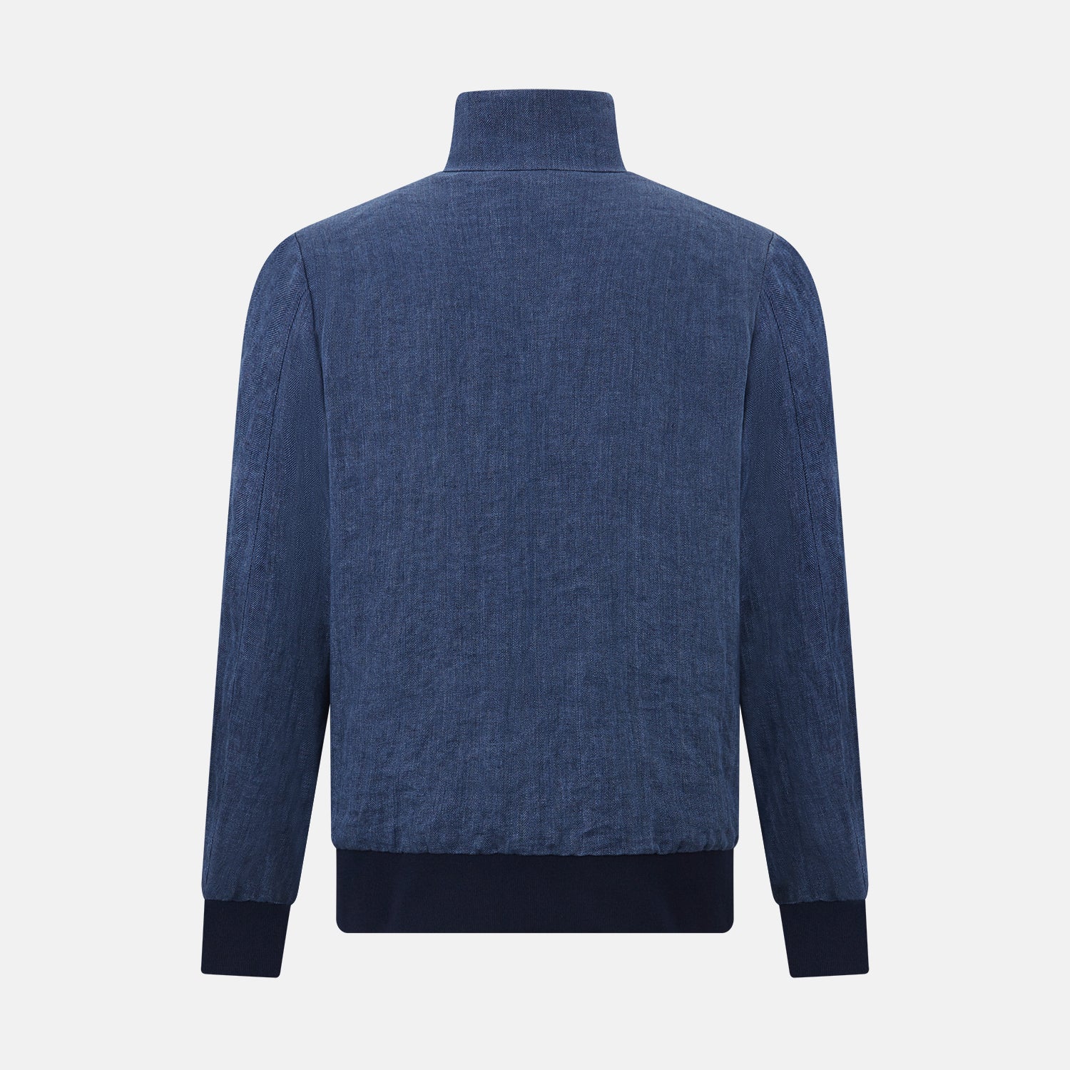 View 3 of product Introducing the Fairway Denim Golf Jacket in Linen by Turnbull & Asser UK—a blue zip-up jacket featuring a high collar, two side pockets, and a zippered chest pocket. The contrasting darker cuffs and hem accentuate its denim-like linen texture, making it the perfect versatile golf jacket for cooler days.