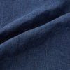 View 5 of product Introducing the Fairway Denim Golf Jacket in Linen by Turnbull & Asser UK—a blue zip-up jacket featuring a high collar, two side pockets, and a zippered chest pocket. The contrasting darker cuffs and hem accentuate its denim-like linen texture, making it the perfect versatile golf jacket for cooler days.