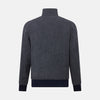 View 3 of product A front view of the Fairway Ash Golf Jacket in Linen by Turnbull & Asser UK is shown, featuring a high collar, two side zip pockets, a chest zip pocket, and black ribbed cuffs and hem. Crafted from lightweight gray herringbone linen for effortless warm-weather dressing, the jacket is displayed on a plain white background.