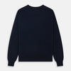 View 4 of product A luxurious navy crew neck cashmere jumper by Turnbull & Asser is laid flat on a white background, evoking timeless Scottish cashmere craftsmanship.