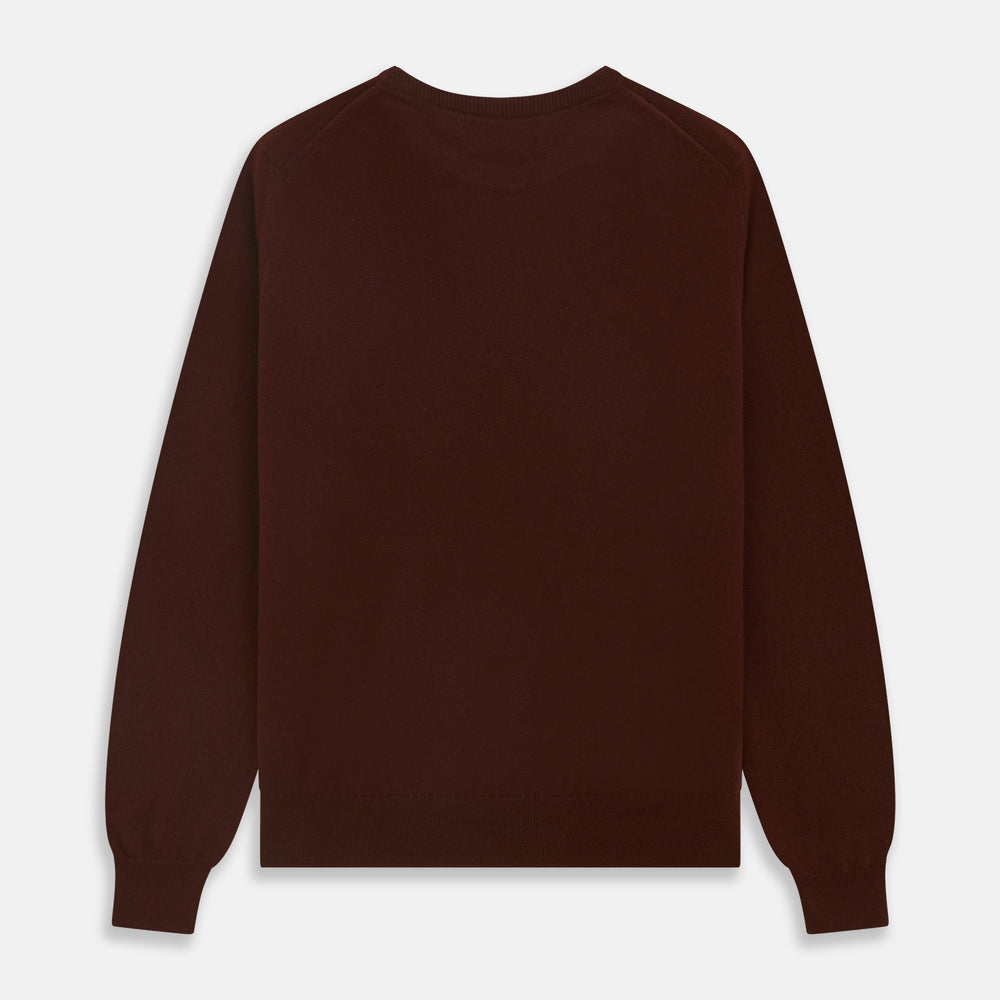 The Turnbull & Asser Port Cashmere Crew Neck Jumper, in dark brown, features a plain design with long sleeves and is shown laid flat on a white background.