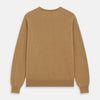 View 4 of product The Turnbull & Asser Camel Crew Neck Merino Wool Jumper is a classic, long-sleeve sweater in camel, laid flat on a white background. Featuring ribbed collar, cuffs, and hem, it’s an essential staple for every gentleman’s wardrobe.