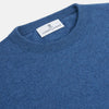 View 2 of product The Turnbull & Asser Blue Crew Neck Cashmere Jumper is laid flat on a white background, showcasing ribbed cuffs, hem, and neckline for an elegant, smart-casual style.