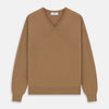 View 1 of product The Turnbull & Asser Natural V-Neck Cashmere Jumper, in camel, features long sleeves and ribbed cuffs, hem, and neckline. Crafted from Scottish cashmere, it’s laid flat on a white background for a refined smart casual look.