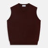 View 1 of product The Turnbull & Asser Port V-Neck Cashmere Slipover is a sleeveless, dark maroon vest with a simple design, shown laid flat on a white background—ideal for layering over a shirt or under a suit jacket.