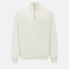 View 1 of product The Turnbull & Asser UK Cream Cashmere Half-Zip Jumper features long sleeves, a high collar, and a front half-zip closure, shown here in ivory on a white background.