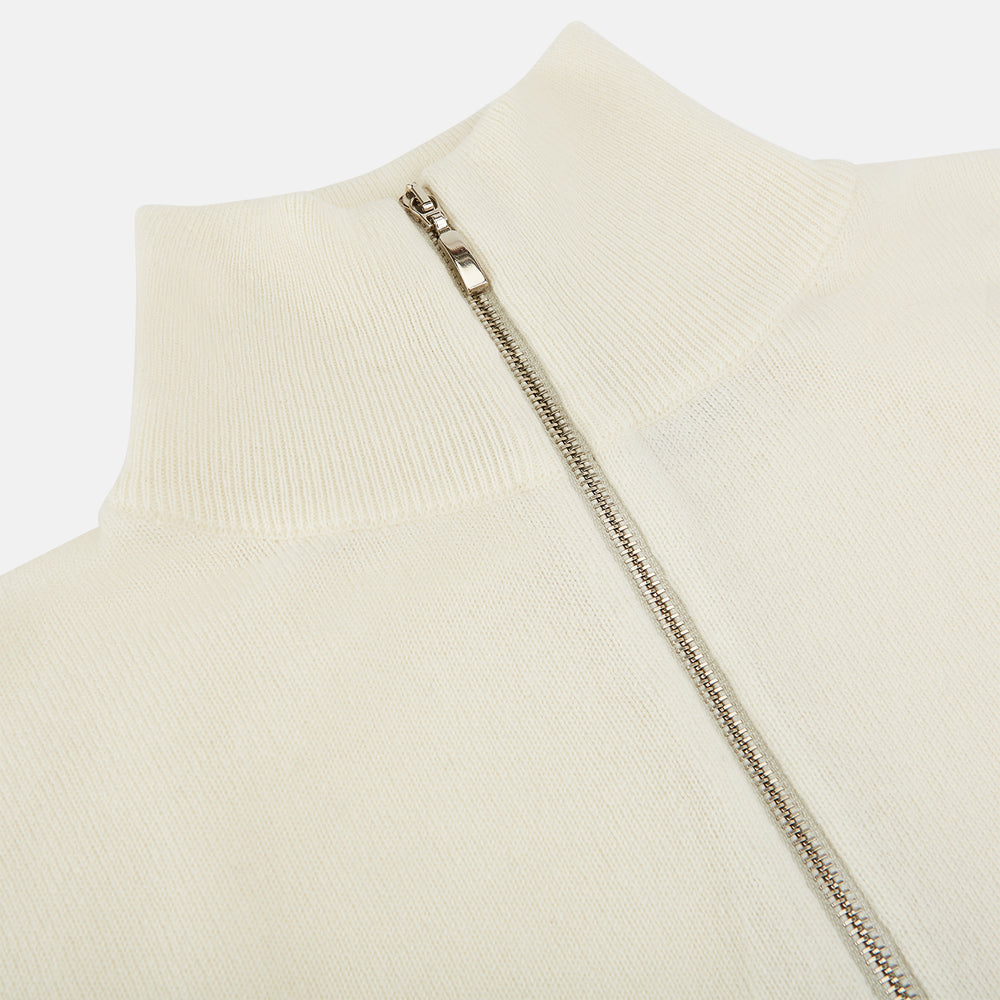The Turnbull & Asser UK Cream Cashmere Half-Zip Jumper features long sleeves, a high collar, and a front half-zip closure, shown here in ivory on a white background.