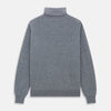 View 4 of product The Turnbull & Asser Kylian Flannel Grey Roll Neck Jumper features long sleeves, ribbed cuffs and hem—ideal for autumn layering. Laid flat on a white background.