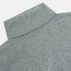View 2 of product The Turnbull & Asser Kylian Flannel Grey Roll Neck Jumper features long sleeves, ribbed cuffs and hem—ideal for autumn layering. Laid flat on a white background.