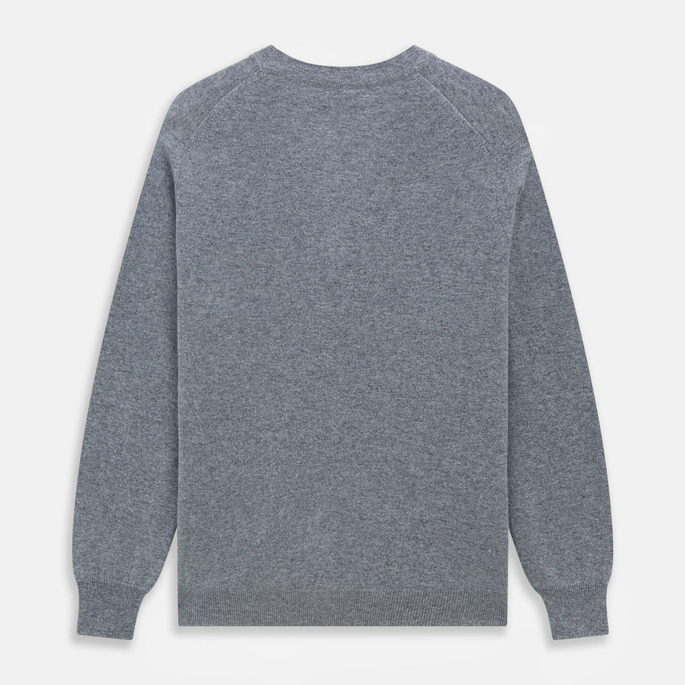 The Louis Flannel Grey Cashmere Cardigan by Turnbull & Asser features long sleeves, a V-neck, black front buttons, and two front pockets, making it ideal for transitional seasons. Shown laid flat on a white background.