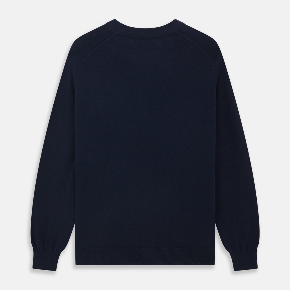 The Navy Cashmere Cardigan by Turnbull & Asser features long sleeves, a V-neckline, button-down front, two front pockets, and ribbed trims, crafted from 21GG cashmere in navy blue and shown laid flat on a white background.