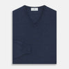 View 3 of product The Blue V-Neck Merino Wool Jumper by Turnbull & Asser features long sleeves, ribbed cuffs, and a ribbed hem—a timeless essential for any gentleman's wardrobe, shown laid flat on a white background.