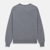 View 4 of product The Turnbull & Asser Grey Crew Neck Merino Wool Jumper, a timeless long-sleeved staple, is shown laid flat on a white background.