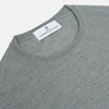 View 2 of product The Turnbull & Asser Grey Crew Neck Merino Wool Jumper, a timeless long-sleeved staple, is shown laid flat on a white background.