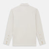 View 3 of product The Turnbull & Asser White Pique Shirt is a long-sleeve, white button-up with a chest pocket and beige buttons, laid flat on a white background, featuring an elevated silhouette inspired by elegant polos.