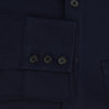 View 4 of product The Turnbull & Asser Navy Pique Shirt is a long-sleeved, dark navy button-up with a left chest pocket, classic collar, and buttoned cuffs, shown laid flat on a white background.