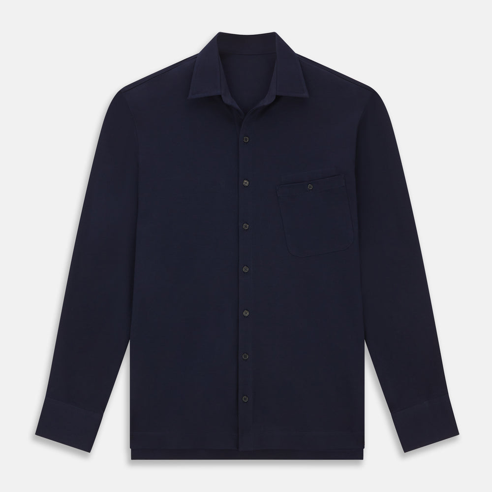 The Turnbull & Asser Navy Pique Shirt is a long-sleeved, dark navy button-up with a left chest pocket, classic collar, and buttoned cuffs, shown laid flat on a white background.