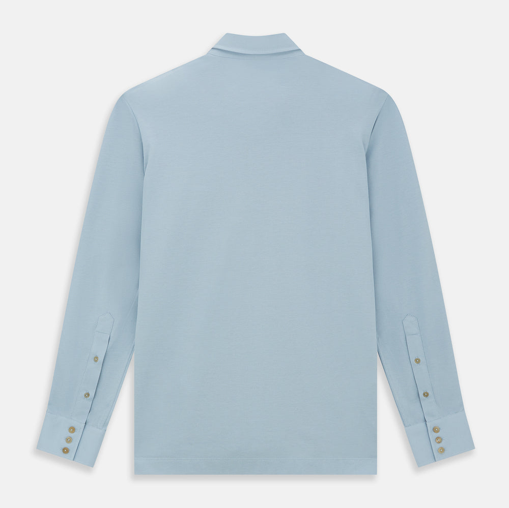 The Turnbull & Asser Pale Blue Pique Shirt is a long-sleeve button-up with an open collar, single chest pocket, and beige buttons, shown against a white background.