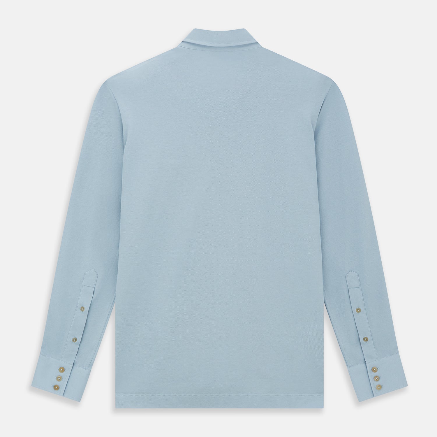 View 3 of product The Turnbull & Asser Pale Blue Pique Shirt is a long-sleeve button-up with an open collar, single chest pocket, and beige buttons, shown against a white background.