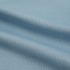 View 6 of product The Turnbull & Asser Pale Blue Pique Shirt is a long-sleeve button-up with an open collar, single chest pocket, and beige buttons, shown against a white background.