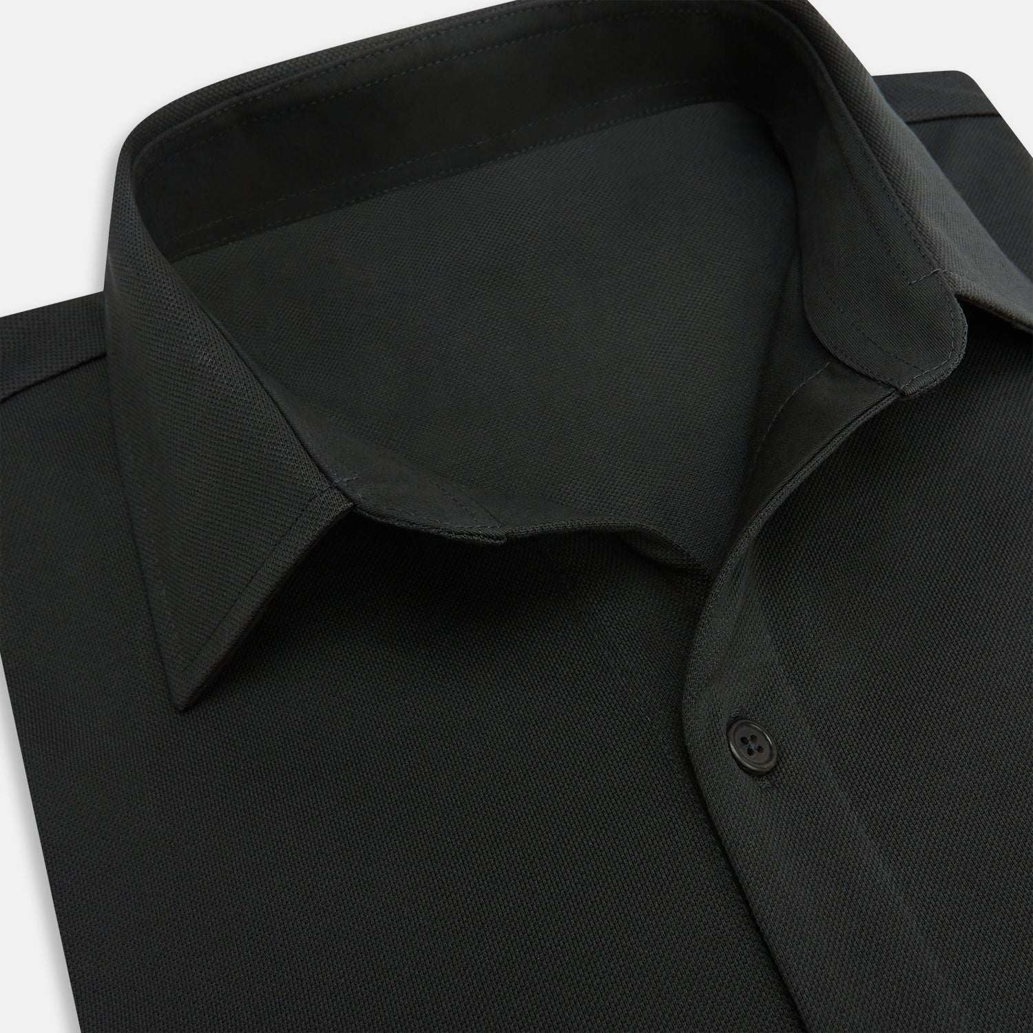 View 2 of product The Moss Green Pique Shirt by Turnbull & Asser, featuring long sleeves, a button-up front, collar, and single chest pocket, is laid flat on a white background for a refined take on classic style.