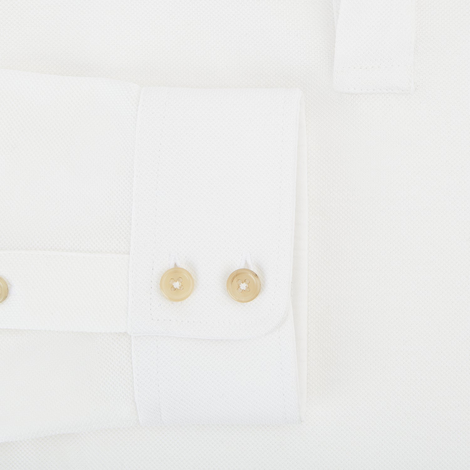 View 4 of product A Cream Rugby Polo Shirt in Cotton by Turnbull & Asser UK, featuring long sleeves, a collar, and a partial button placket, is displayed on a white background.