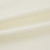 View 5 of product The Cream Nightshirt by Turnbull & Asser is a long-sleeved, cream-colored shirt dress with a collar, partial button front, chest pocket, and relaxed fit—ideal as comfortable sleepwear—shown on a plain white background.