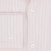 View 4 of product The Turnbull & Asser Pale Pink Bengal Stripe Nightshirt features long sleeves, a subtle striped pattern, a collar, chest pocket, and front buttons. Shown flat on a white background, this stylish sleepwear offers comfort and elegance.