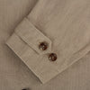 View 4 of product The Sand Long Albert Trench Coat by Turnbull & Asser UK features a double-breasted design, dark buttons, notched collar, and two slanted front pockets, offering timeless British style. Shown against a plain white background.