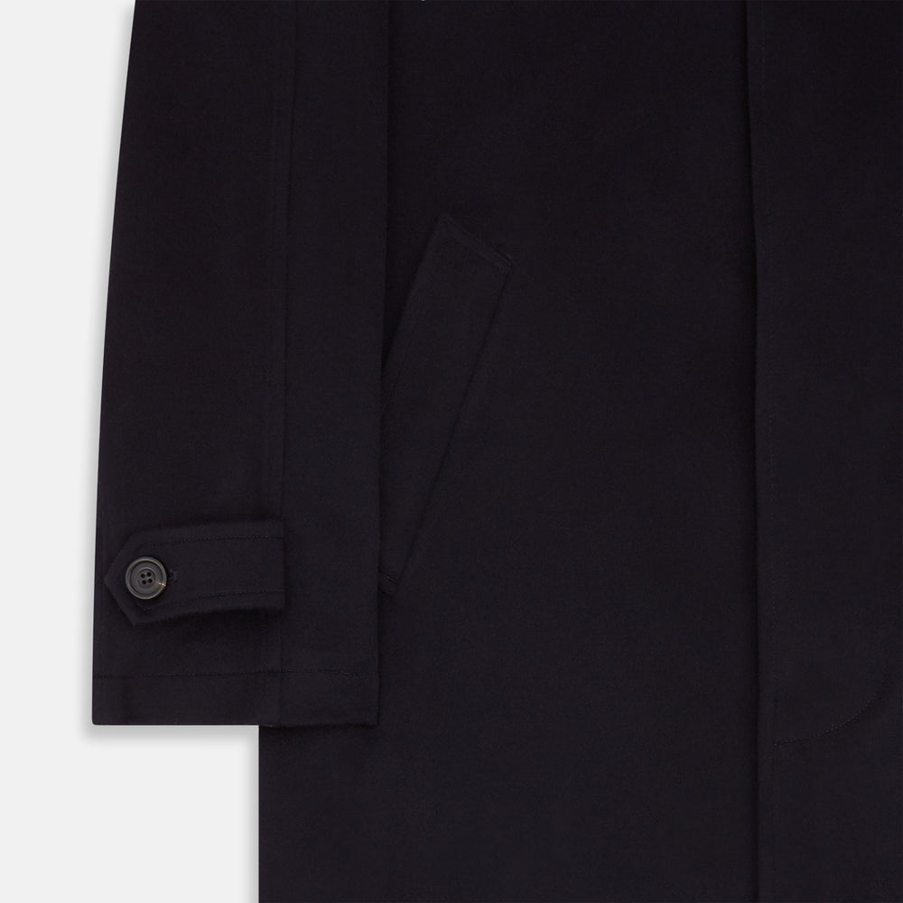 The Turnbull & Asser Dark Navy Cashmere Storm System Smith Coat, featuring a classic collar, buttoned front, side pockets, and buttoned cuffs, is shown laid flat on a white background.