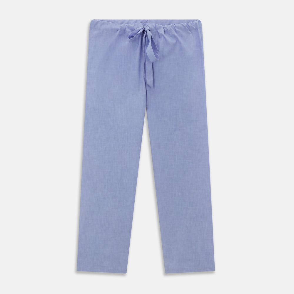 The Blue Piped End-on-End Cotton Pyjama Set by Turnbull & Asser features light blue long sleeves, red piping, front buttons, chest pocket, and matching drawstring pants—luxurious sleepwear laid flat on a white background.