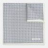 View 1 of product A white silk pocket square from Turnbull & Asser UK, featuring a floral pattern and discreetly finished with the brand’s logo in one corner, this Floral White Pocket Square is neatly folded to showcase both its design and craftsmanship.