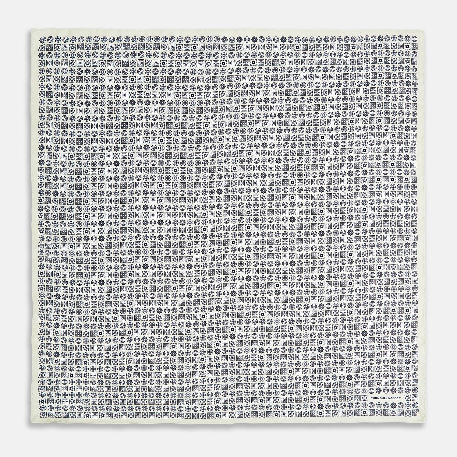View 4 of product A white silk pocket square from Turnbull & Asser UK, featuring a floral pattern and discreetly finished with the brand’s logo in one corner, this Floral White Pocket Square is neatly folded to showcase both its design and craftsmanship.