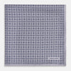View 3 of product A lilac silk pocket square featuring a repeating geometric rosette pattern. One corner is folded over to show the reverse side, and "Turnbull & Asser UK" is printed in the bottom right corner.