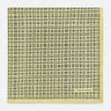View 3 of product A Floral Yellow Pocket Square in Silk by Turnbull & Asser UK, showcasing a repeating black geometric pattern with subtle floral motifs and the brand logo in one corner. One corner of the fabric is folded over to display the reverse side.