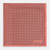 View 3 of product The Floral Orange Pocket Square in Silk by Turnbull & Asser UK features a coral and navy geometric floral pattern with orange accents, neatly folded at the corner. The brand name, Turnbull & Asser UK, is printed in white near the edge.