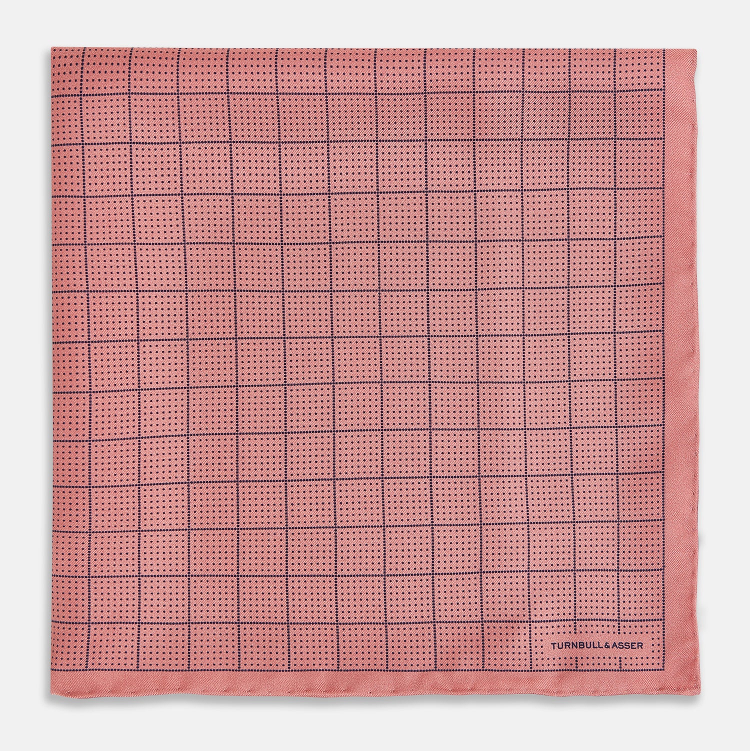 View 3 of product Introducing the Checked Pink Pocket Square in Silk from Turnbull & Asser UK, crafted with a geometric grid pattern of black lines and micro dots on soft pink silk. The design features a neatly folded corner and "Turnbull & Asser" subtly printed in the bottom right.