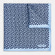 A light blue double-sided pocket square made of silk, featuring a dense pattern of small, dark blue floral motifs. One corner is folded over to reveal the Turnbull & Asser UK brand name printed in blue.