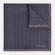 A folded Floral Purple Pocket Square in Silk by Turnbull & Asser UK, featuring a double-sided design with a pattern of small, dark blue circles and the brand’s logo printed in one corner.